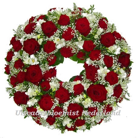 Ajourkrans gevuld met rood witte bloemen ( UB 403 )